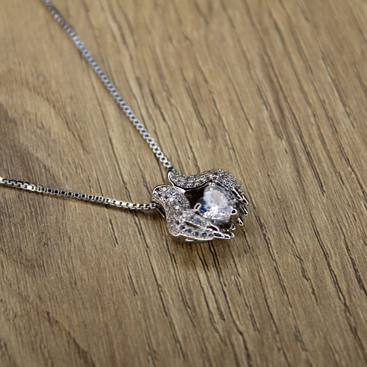 Hands Holding Love Necklace